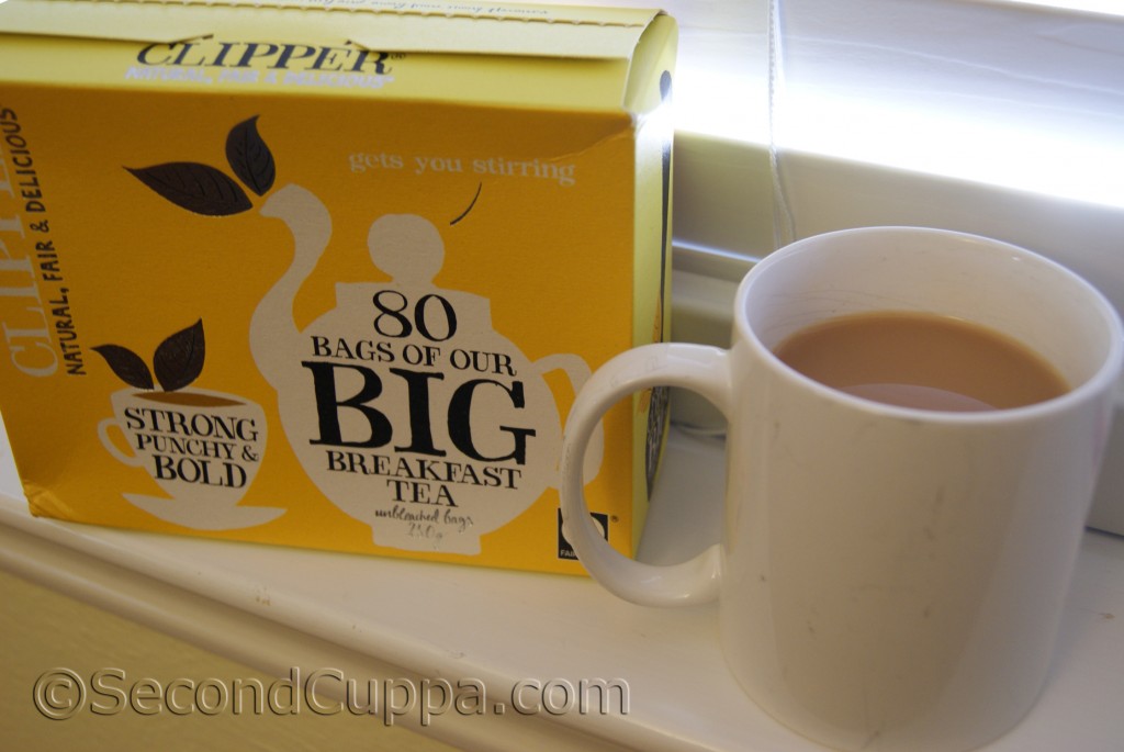 Package of Clipper Big Breakfast Tea beside a mug of tea
