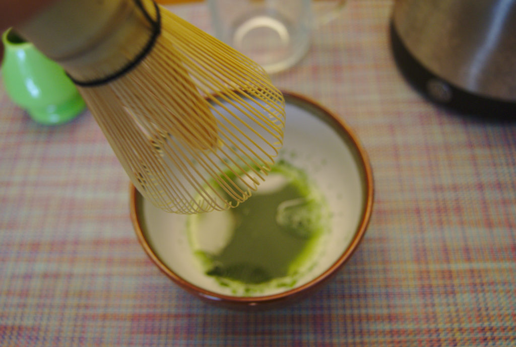 Whisking the matcha