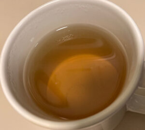 Trader Joe's Green Tea after steeping, exhibiting a yellowish green color