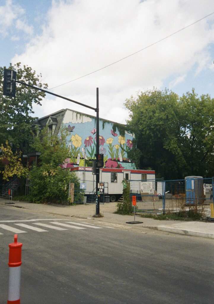 Flower mural on the side of a building
